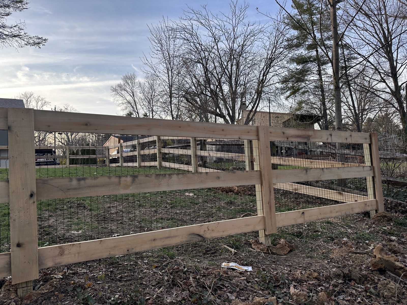 Split rail fence framing a driveway entrance in Cincinnati