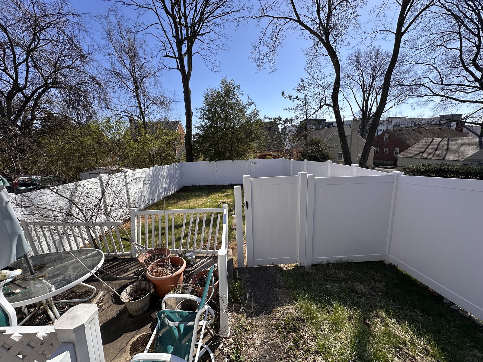 White vinyl privacy fence around a back patio in Cincinnati