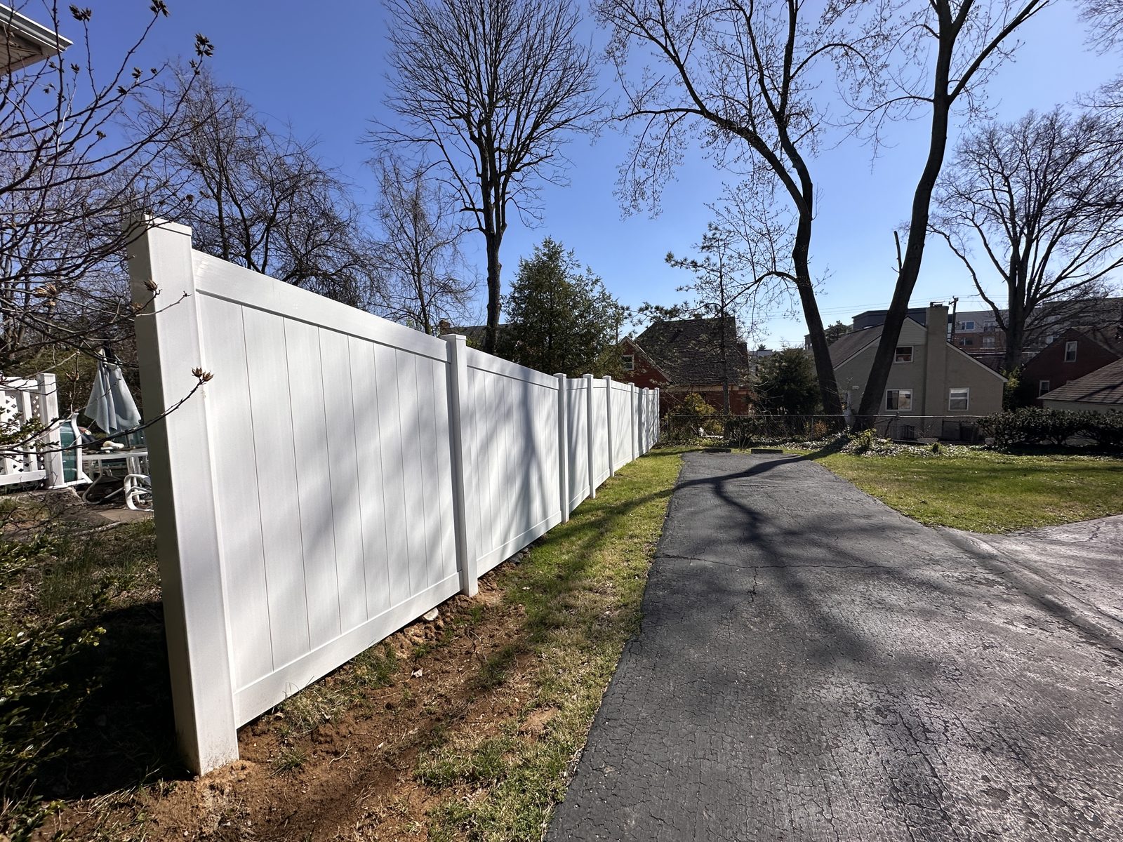White vinyl privacy fence along a Cincinnati street
