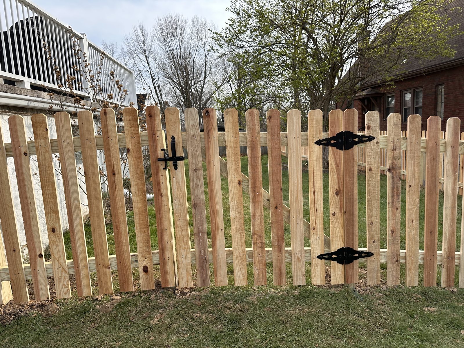 Wood picket fence with double gate