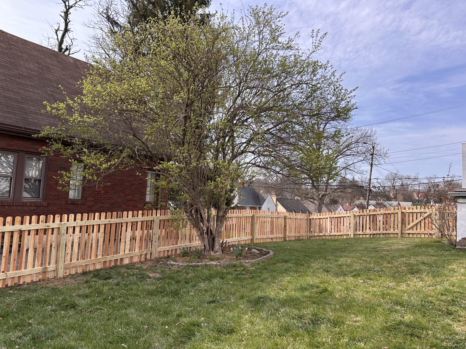 Wood picket fence along a front yard in Cincinnati