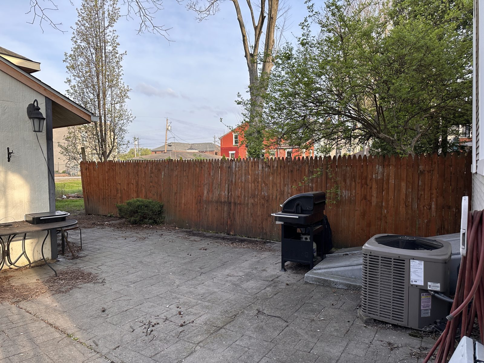 Wood privacy fence enclosing a back patio