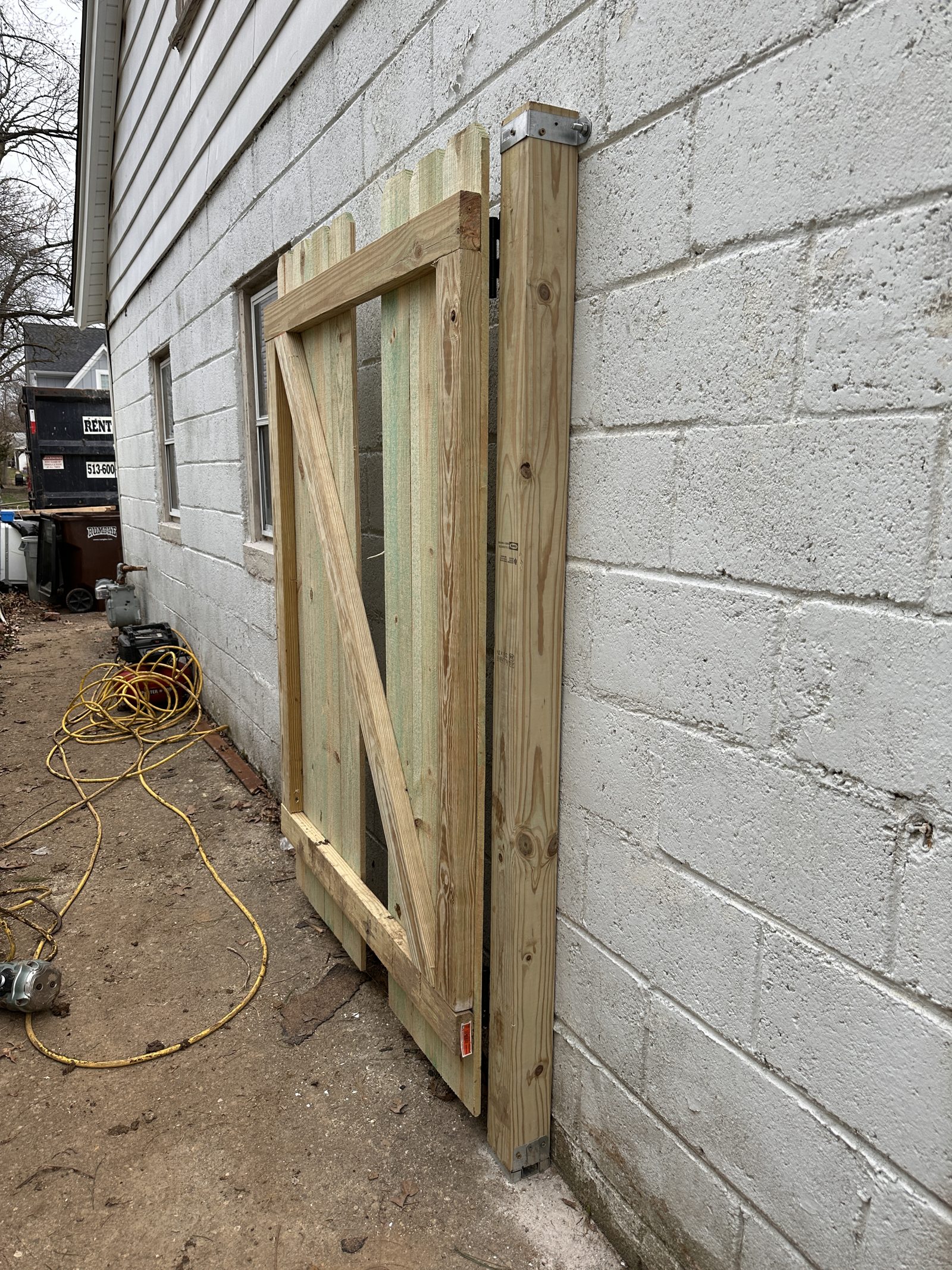 Heartwood crew building a wood gate frame on site