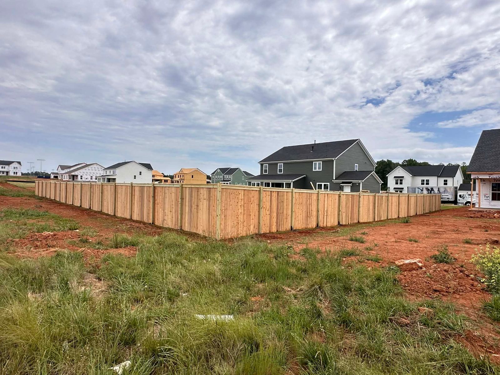 New wood privacy fence around a new-build home in Greenville